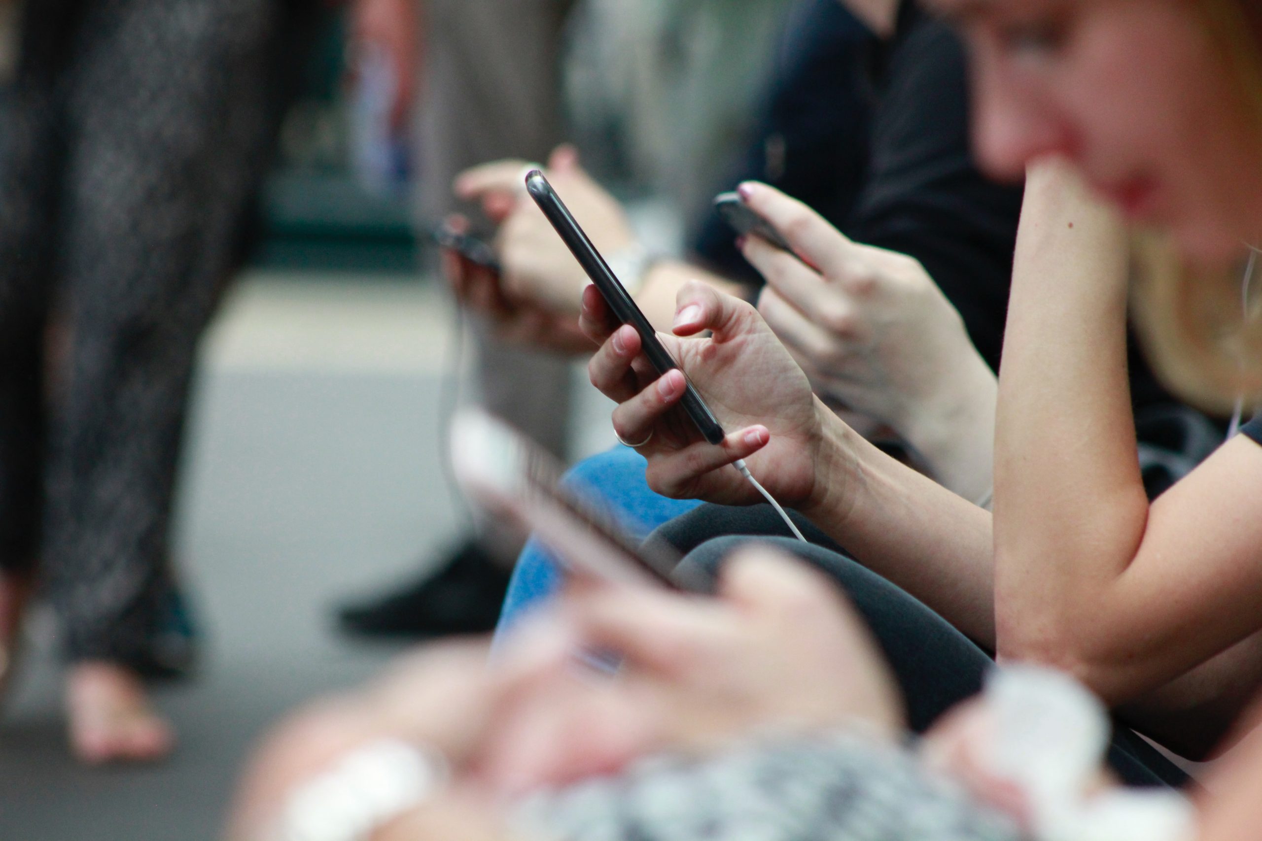multiple people with phones