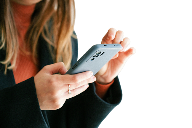 close image of a woman holding her phone