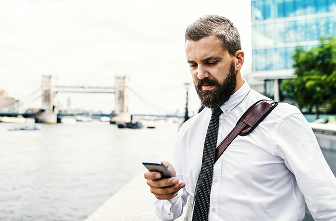Man looking down at phone