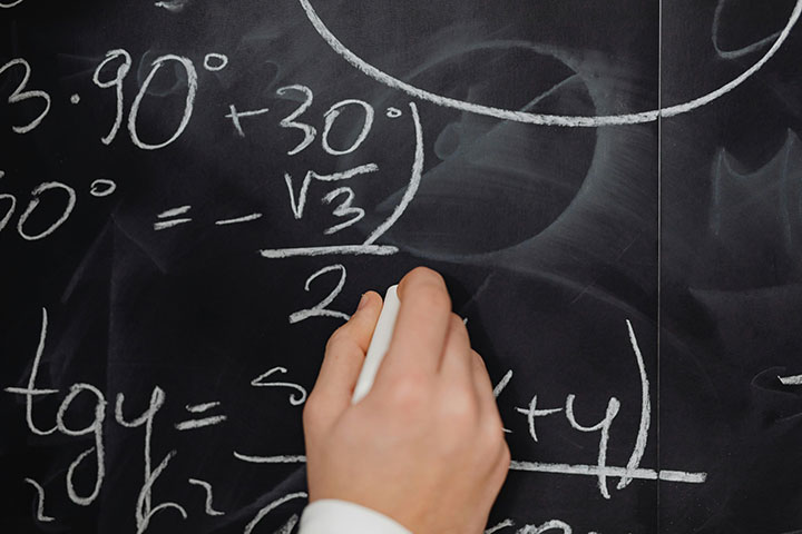business-math doing math on a chalkboard