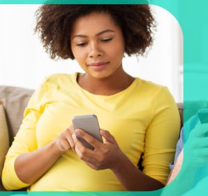 Woman in a yellow tee receiving a text a notification text about her next doctor's appointment.