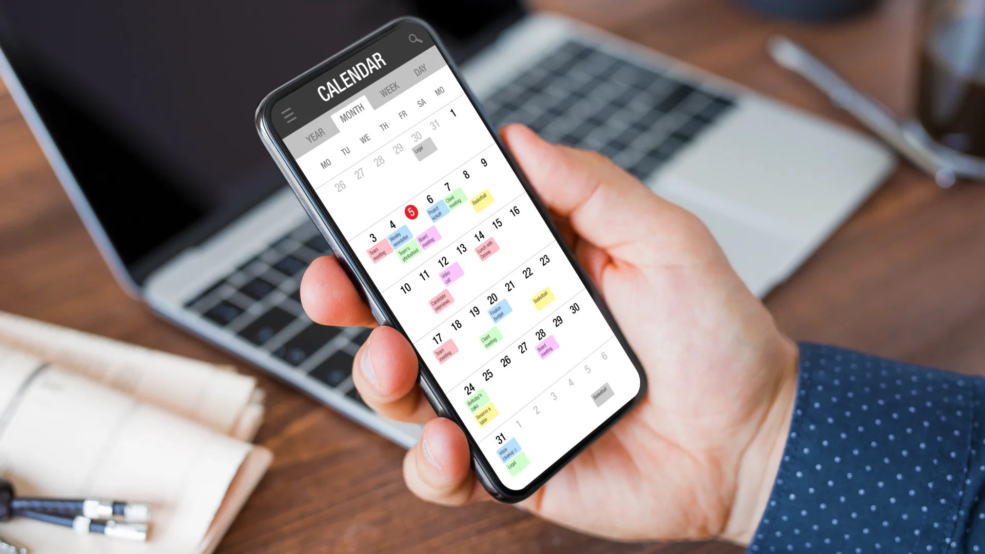 Man Holding phone with calendar