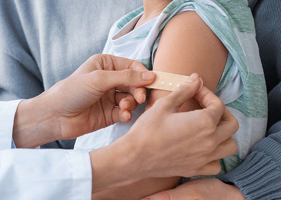 Child just having to receive a vaccine at an immunization clinic