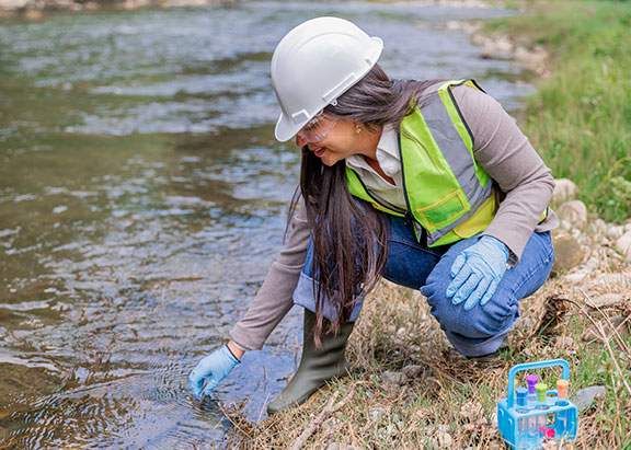 Environmental engineer testing water quality